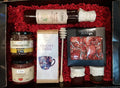 Geschenkkorb mit Premium‑Tee Honig handgemachter Schokolade Konfitüre Sirup im dekorativen Korb